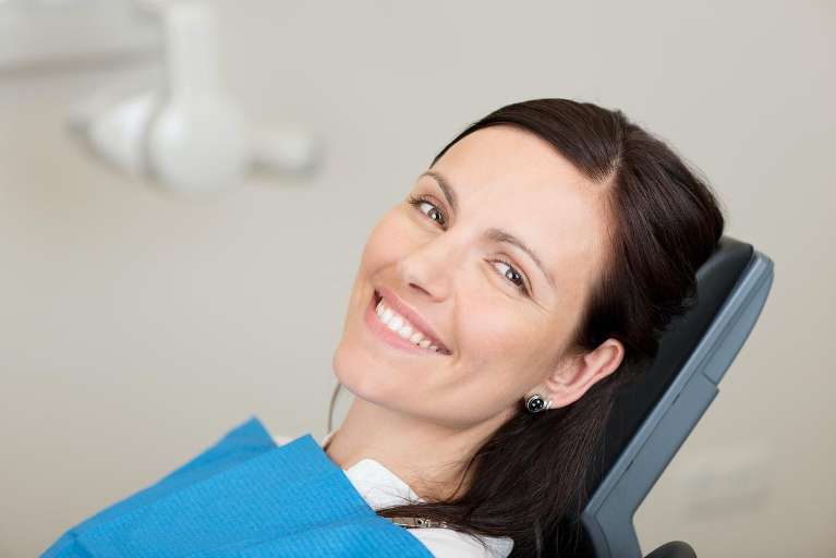 woman at her dentist office in burke va